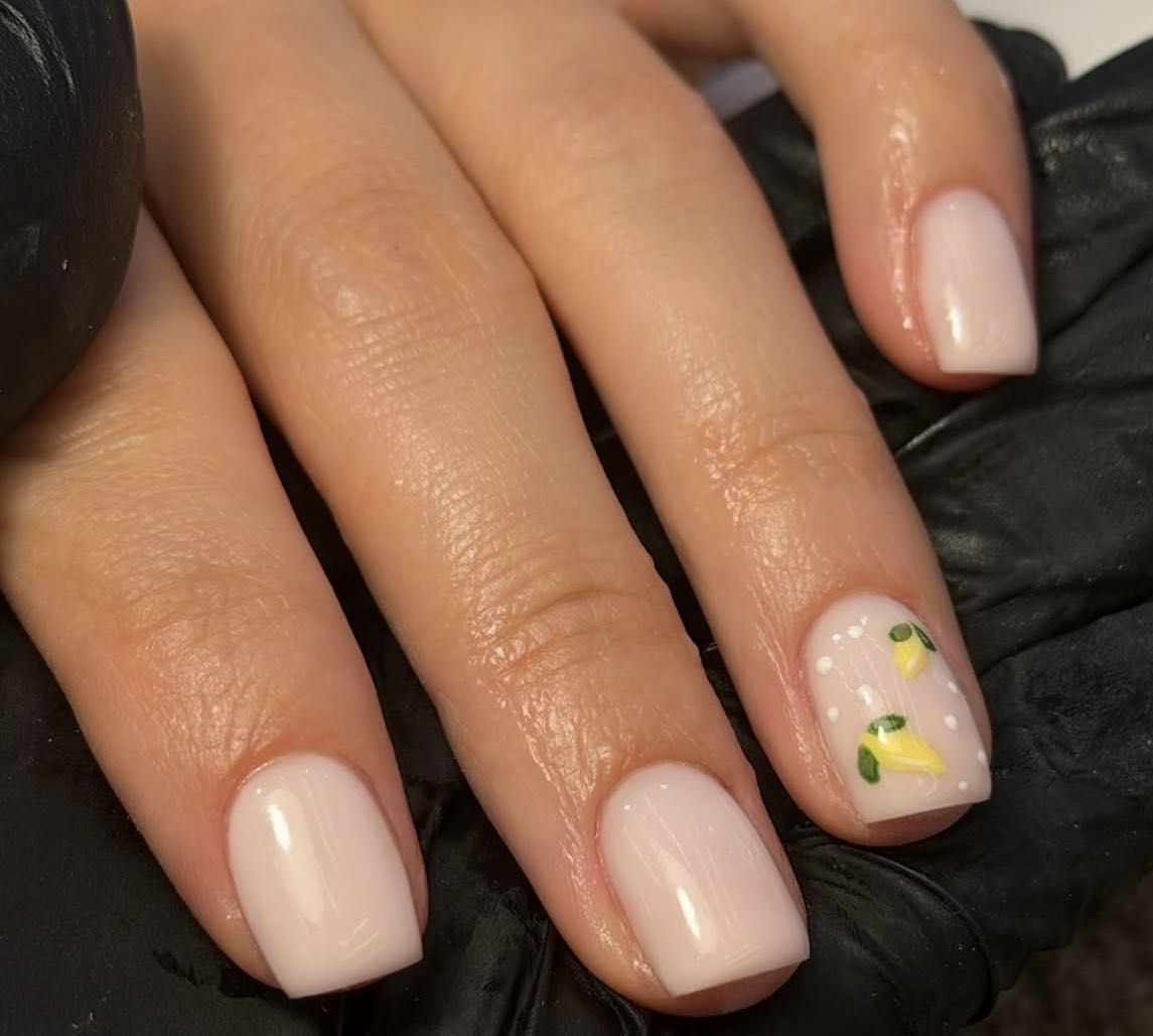 Soft nude manicure with delicate lemon nail art by OKO